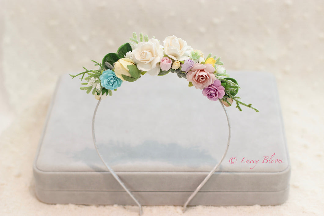 Floral hairband on metal hairband.